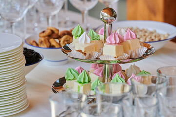 cakes on a tray on a table at a holiday in a restaurant