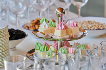 cakes on a tray on the table in a restaurant for a holiday