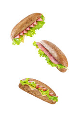 Rye sandwich with sausage, cheese and salad leaves on a white isolated background