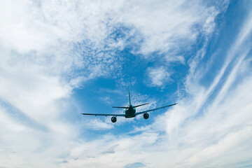 Fototapeta na wymiar Flight of the passenger plane above the clouds.