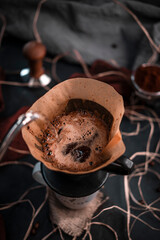 Presentation of bean coffee varieties with different types of cups on a special ground