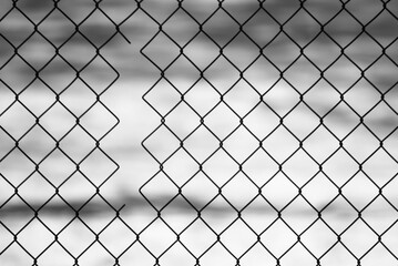 gray background, in the photo a metal mesh on a background of white snow