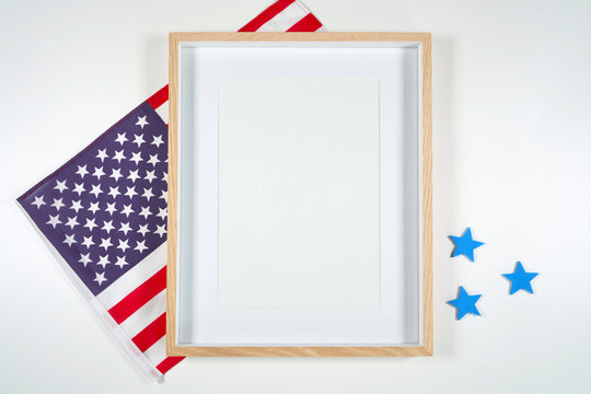 Art print vertical frame product mockup. Patriotic Fourth of July, Independence Day theme craft product mockup styled with USA Stars and Stripes flag against a white background.