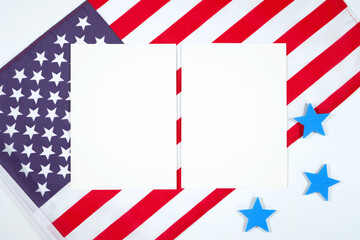 Fototapeta premium Two 5x7 greeting card party invitations product mockup. Patriotic Fourth of July, Independence Day theme craft product mockup styled with USA Stars and Stripes flag against a white background.