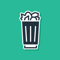 Blue Full trash can icon isolated on green background. Garbage bin sign. Recycle basket icon. Office trash icon. Vector