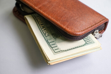  Wallet with american dollars on a light background