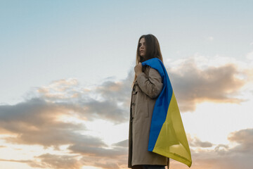 woman in the sky with Ukrainian flag