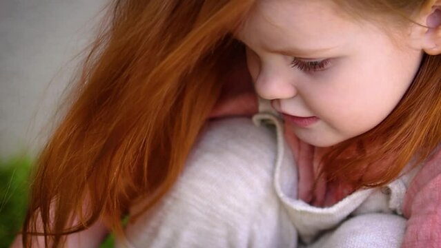 portrait of cute redhead baby girl