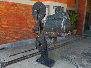 Old vintage 35mm film projector on display outside a former warehouse in Thessaloniki, Greece.