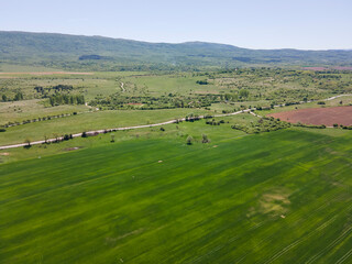 Fototapeta premium Spring Aerial view of rural land near town of Godech, Bulgaria