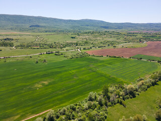 Fototapeta premium Spring Aerial view of rural land near town of Godech, Bulgaria