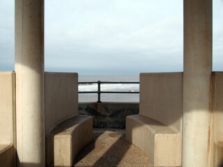 concrete seats in a seafront shelter in cleveleys in merseyside