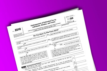 Form 2210 documentation published IRS USA 44441. American tax document on colored - obrazy, fototapety, plakaty