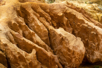 Natural sand formed by erosion of the elements