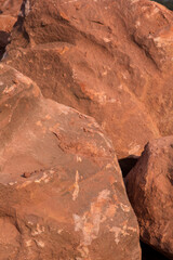 Brown mountain sandstone with large chunks of patterns, designed to be like nature by heavy machinery, beautifully crafted in a vast lakeside garden, perfect for relaxing and watching nature in summer