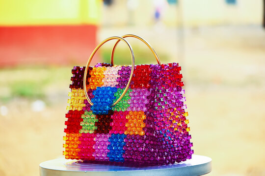 Colorful beaded bag made with square beads. Fashion bag with beautiful beaded pattern