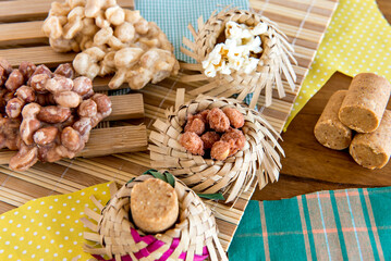Festa Junina decorated table, straw hat, banners and sweets, Brazilian sweets.