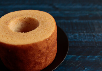 Eating Baumkuchen as a gift at a wedding ceremony at the table at tea time
