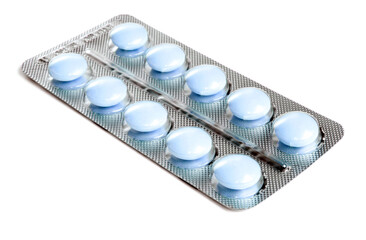 Pack of blue tablets isolated on white background. - obrazy, fototapety, plakaty