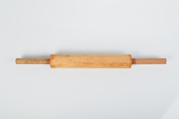 Wooden rolling pin for bread rolls isolated on a white background