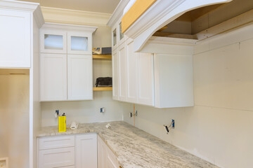 Kitchen furniture set installation in hanging cabinet for new house