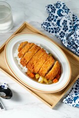 Crispy fried pork cutlet with curry rice and soup, Japanese food