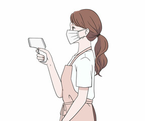 マスクをつけて検温をする横を向いたエプロン姿の女性