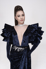 beautiful girl in an evening dress in the studio