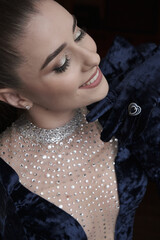 beautiful girl in an evening dress in the studio