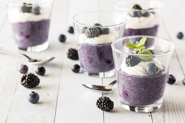 Blueberry chia pudding parfaits topped with vanilla yogurt and berries.