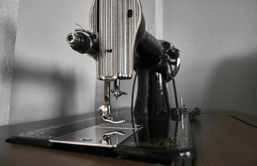 Antique sewing machine. Old sewing machine details. Vintage tailor sewing machine.