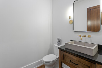 Fototapeta na wymiar One sink bathroom with black mirror