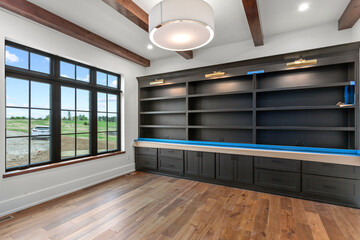 Empty office with black windows and custom built ins