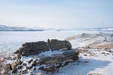 Baikal lake in winter with transparent cracked blue ice. Beautiful winter landscape. Baikal,...