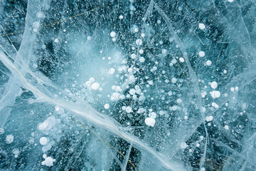 Naklejka na ściany i meble Baikal Lake. Unusual winter landscape. White layered bubbles in transparent ice