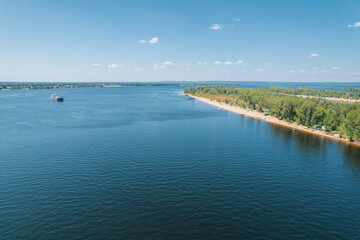 Aerial landscape view on Volga river with islands and green forest. Picturesque panoramic view from the height on the touristic part of the Volga river near Samara city at summer sunny day.