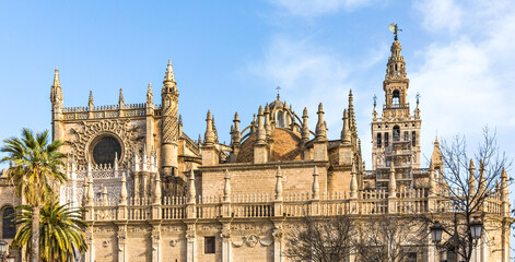 Fototapeta na wymiar Seville cathedral Giralda tower of Sevilla Andalusia Spain Church on sunny day.