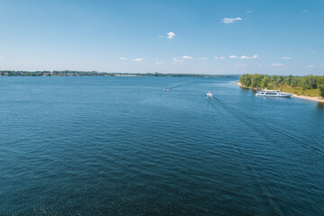Aerial landscape view on Volga river with islands and green forest. Picturesque panoramic view from the height on the touristic part of the Volga river near Samara city at summer sunny day.