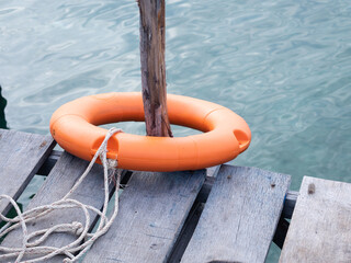 Plastic lifebuoys are installed at the piers to prevent tourists from falling into the river or sea. - 507201324