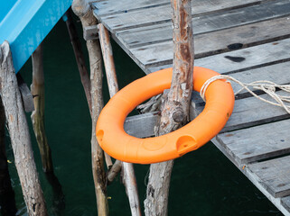 Plastic lifebuoys are installed at the piers to prevent tourists from falling into the river or sea. - 507201325