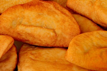 fried panzerotti which are like sandwiches filled with mozzarella and tomato and then cooked in boiling oil typical Italian dish