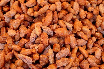 background of roasted caramelized sugar coated almonds