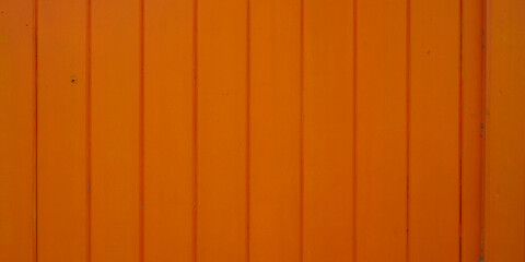 orange wood background facade wall made of brown wooden planks