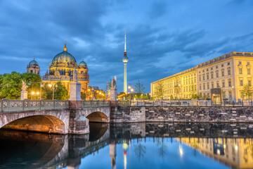 The Berlin Cathedral, the famous TV Tower and a part of the rebuilt City Palace at night © elxeneize