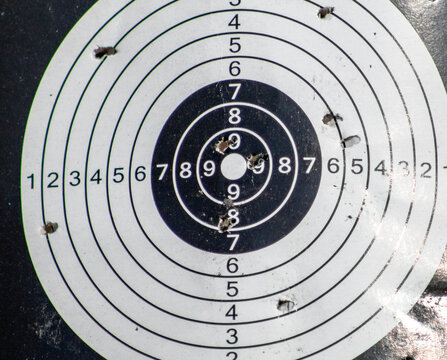 Shot through a paper target for a shooting range.