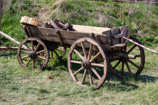 Old wooden cart with wooden wheels.