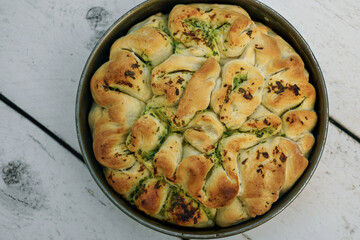 Artisan bread with different herbs. Fresh baked bread in cake form.