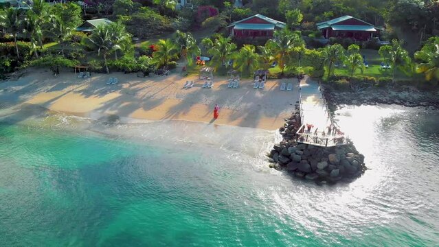 St Lucia Caribbean, couple men and women on vacation,Huge pitons drone view at Saint Lucia sugar beach St Lucia mountains at the beach with clear ocean