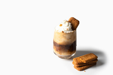 Coffee glass cup with biscuits.Popular hot beverage with cookies spread and vipped cream