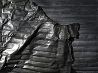 Warping corrugated metal.